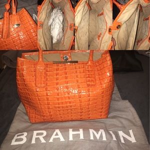 Brahmin orange hand bag with dust cover